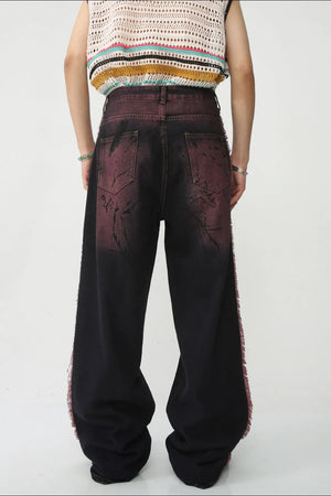Distressed wide-leg jeans in mocha with frayed trim and a washed effect.