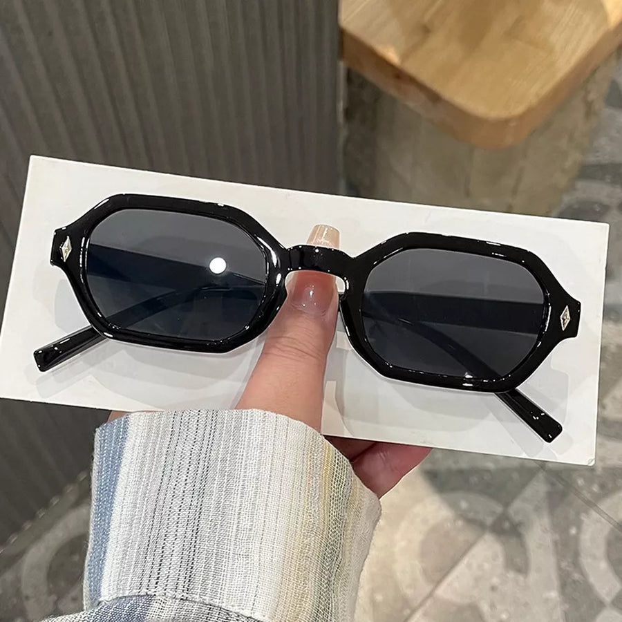 sunglasses in black featuring UV protection and geometric fit