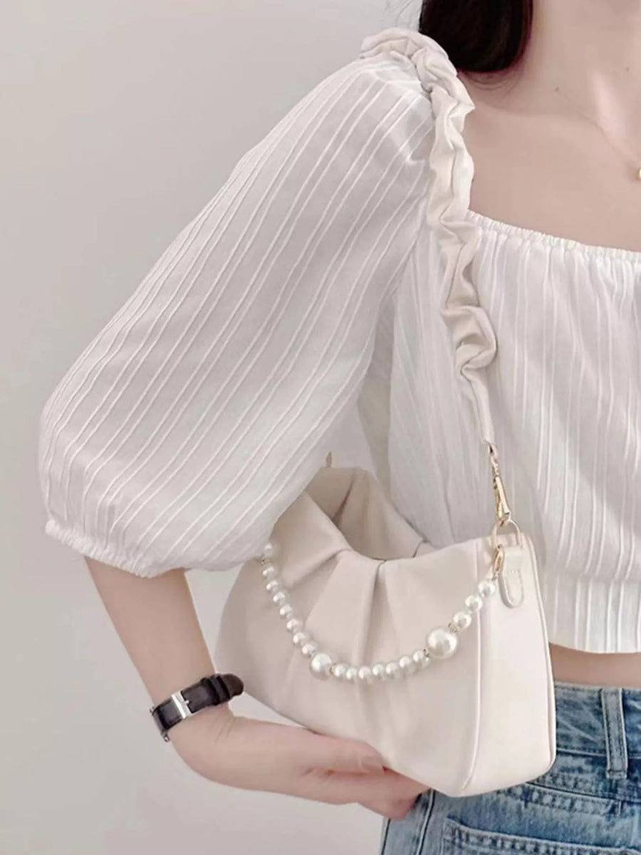 Beige ruched shoulder bag with pearl strap detail
