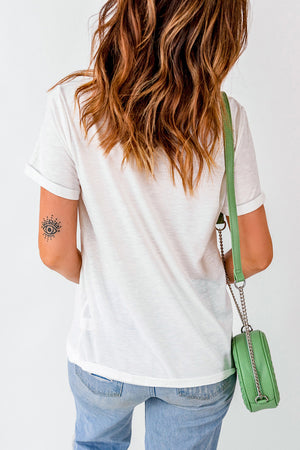 White VIBE VIBRATIONS graphic tee with rolled sleeves and an eye tattoo on the arm.