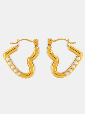Gold wave hoop earrings with pearl accents