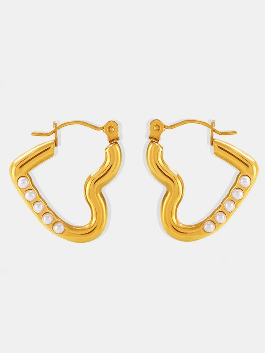 Gold wave hoop earrings with pearl accents