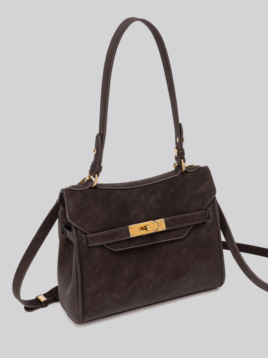 crossbody bag in dark brown with gold-tone hardware and medium