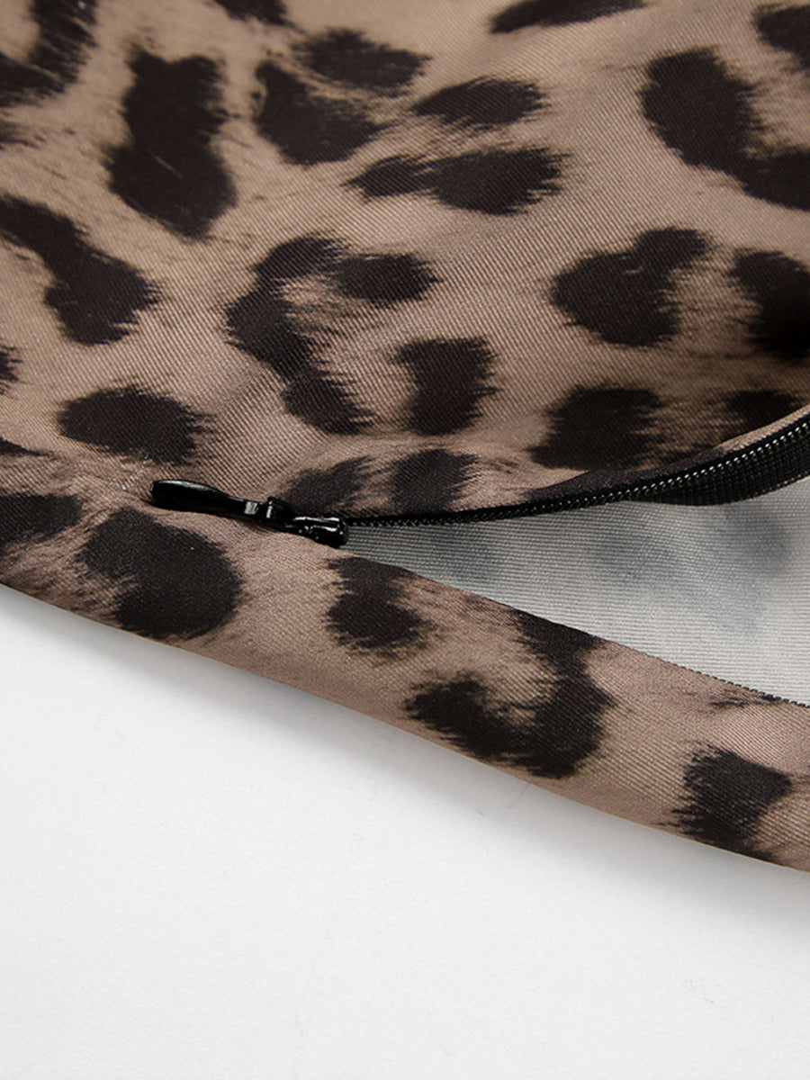 Flowy leopard print maxi skirt detail showing zipper closure.