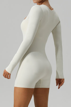 Sculpted square neck ivory long sleeve unitard with short legs.