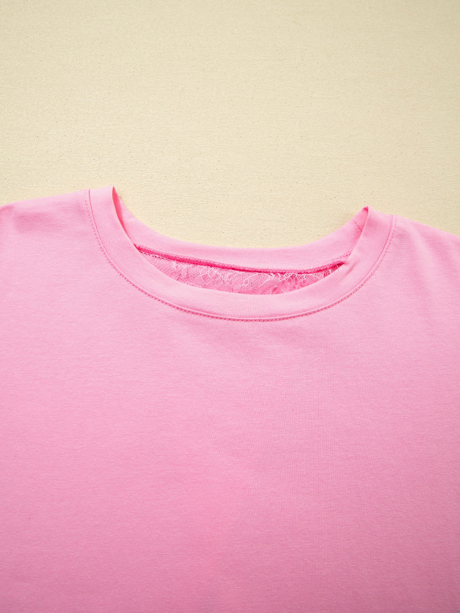 Pink cotton blend oversized tee with floral lace detail at the neckline.
