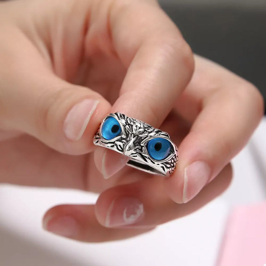 bright blue ring featuring owl design and animal motif