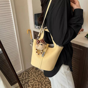 PU Leather Imported Size & crossbody bag in pale yellow with bucket silhouette