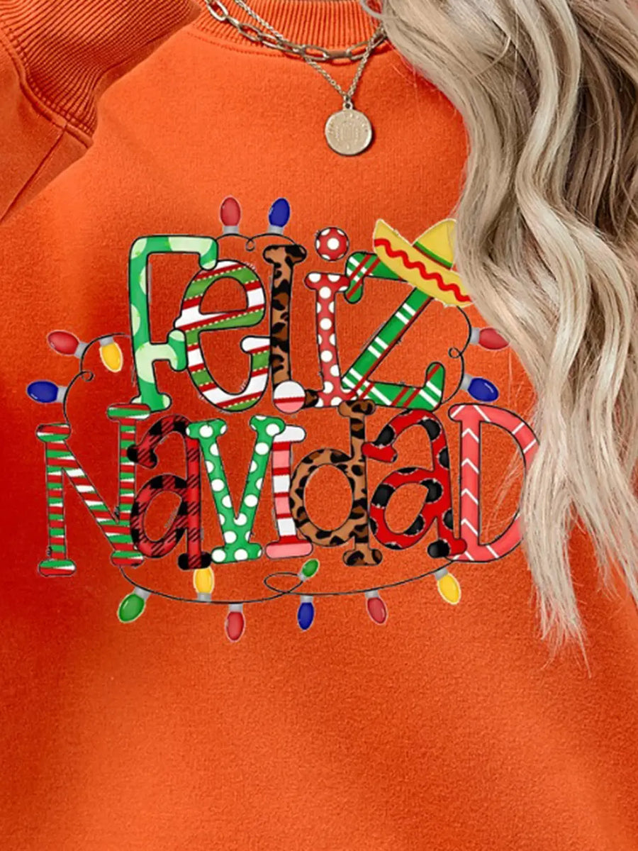 Orange graphic sweatshirt with Feliz Navidad text and Christmas lights.