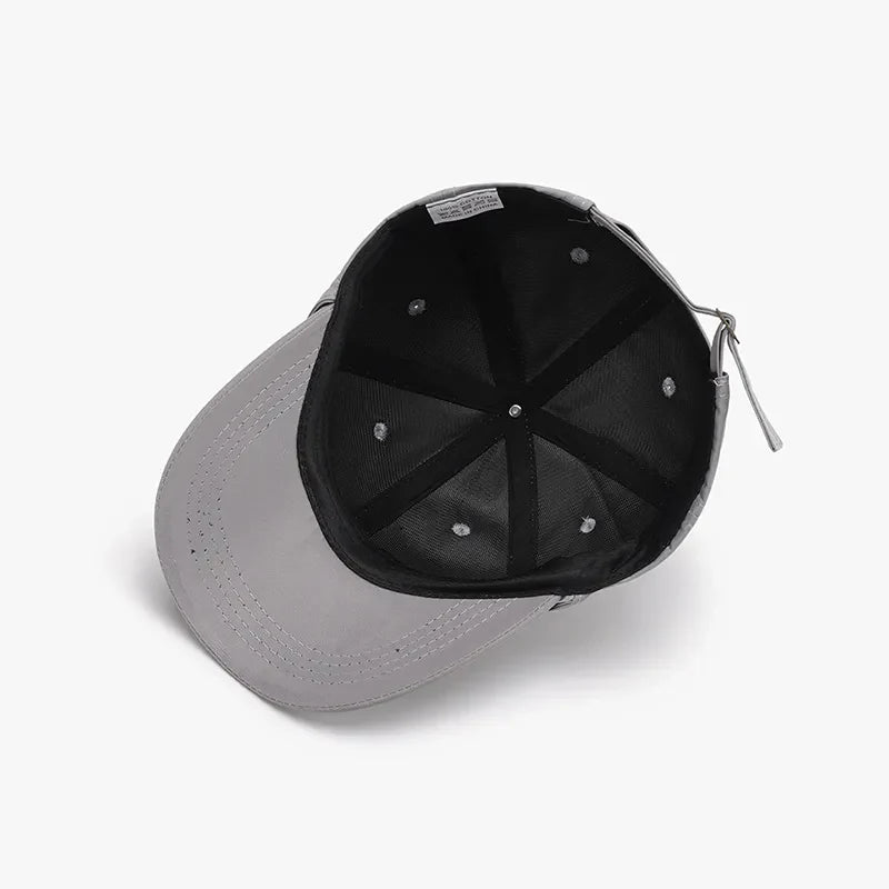 Gray baseball cap with adjustable tie-back detail and breathable design