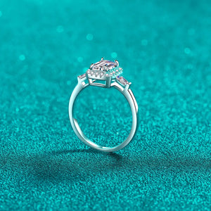 Sterling silver ring with emerald cut moissanite and halo, available in royal blue and white