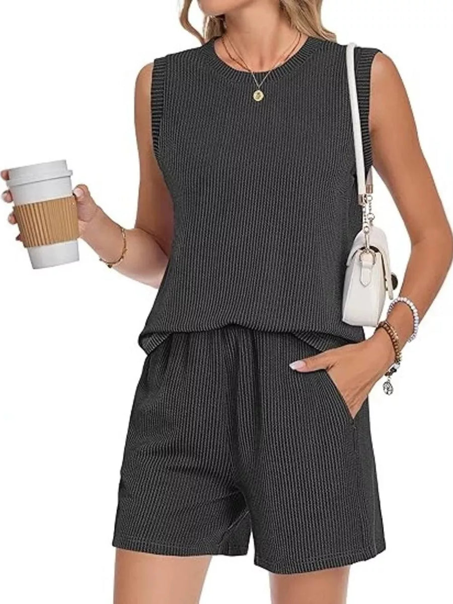 Black ribbed knit sleeveless top and shorts set with pockets.