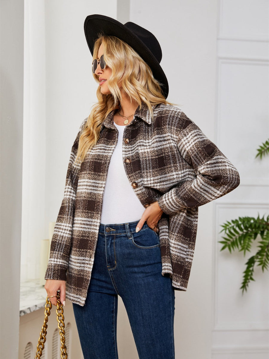 Brown plaid shacket with oversized button detail and collared neckline.