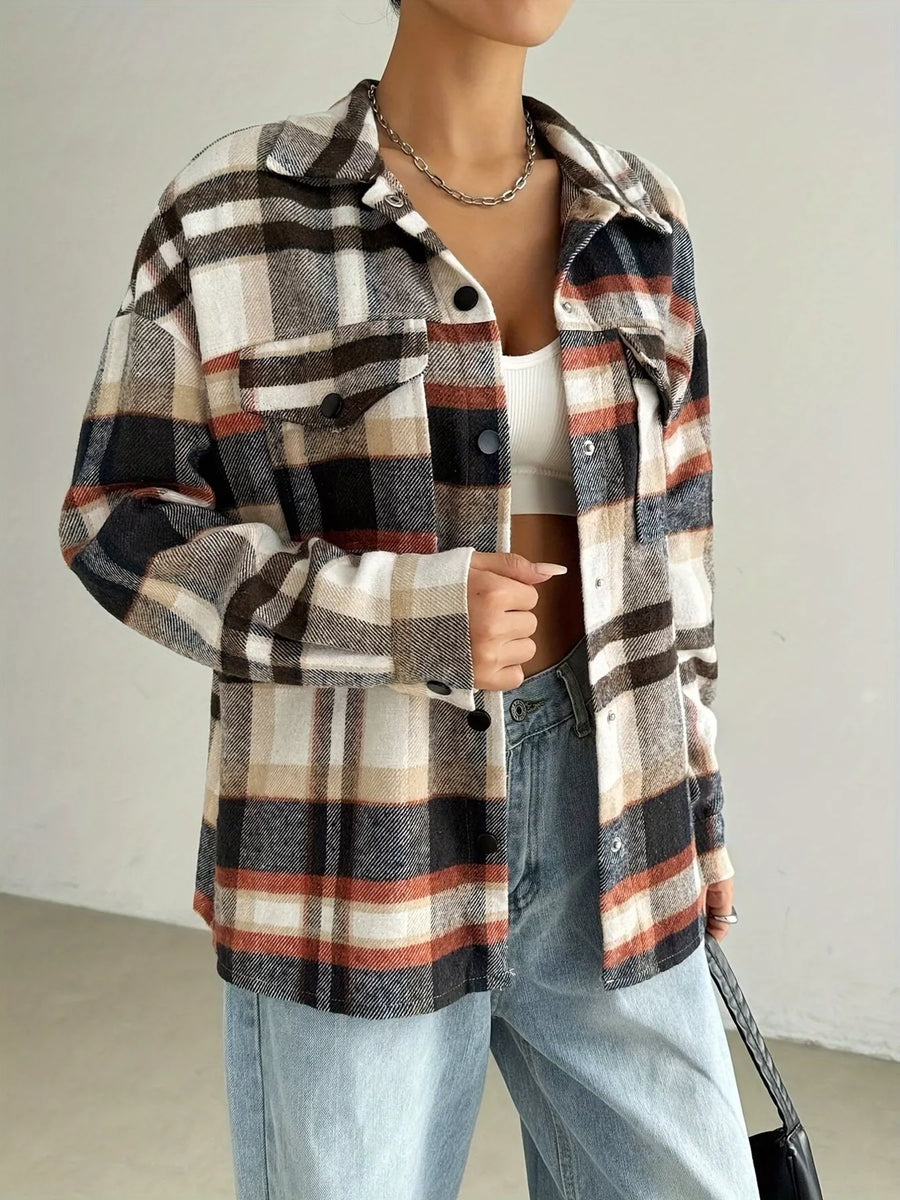 Relaxed fit plaid shirt jacket in mocha with button front and chest pockets.