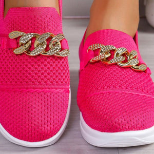 Pink mesh slip-on flats with chunky gold chain detail.