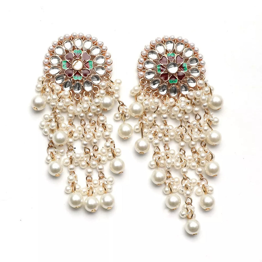 Lustrous pearl fringe statement earrings with floral detail and clear stones.