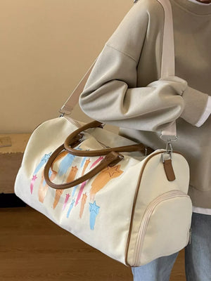Off White canvas duffle bag with colorful star design and brown handles