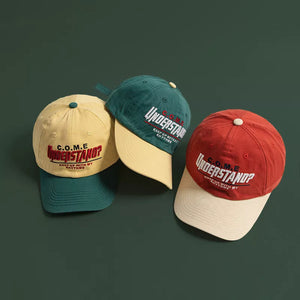 Embroidered statement baseball caps in red, green, and yellow with contrasting brims.