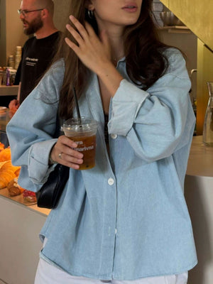 95% cotton, 5% spandex Care instructions: Machine wash cold button-up shirt in Light Blue with oversized silhouette