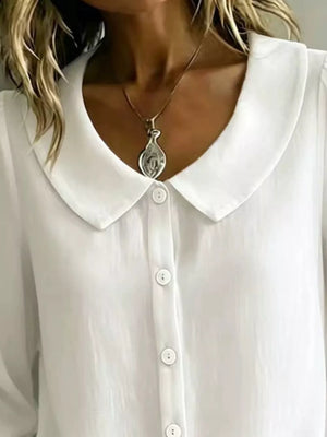 100% polyester Care instructions: Machine wash cold button-down shirt in Black with relaxed silhouette
