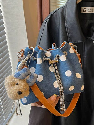 crossbody bag featuring polka dot in Blue with Polyester Imported Size & texture