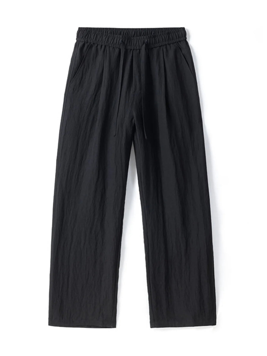 Black lightweight wide-leg trousers with drawstring waist and textured fabric.