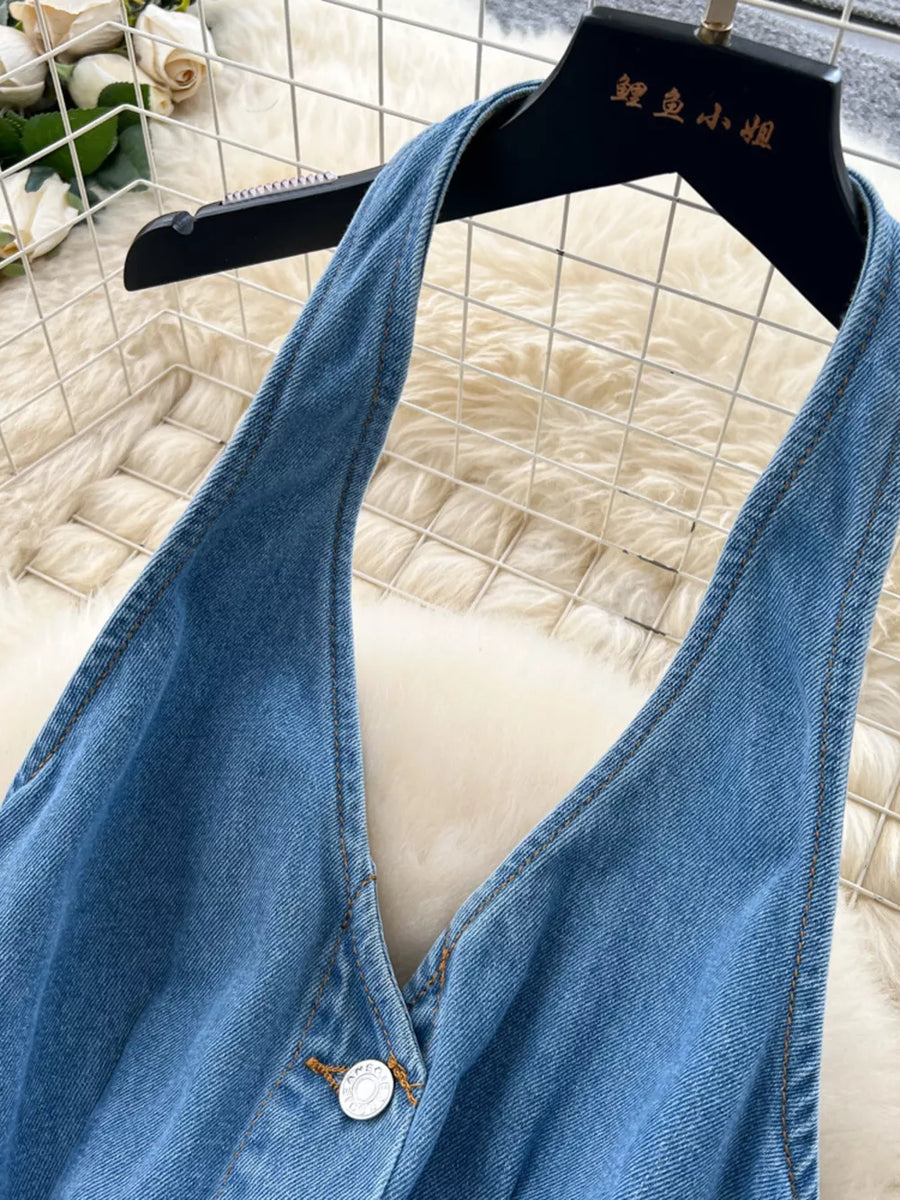Blue denim V-neck dress with button placket and contrast stitching.