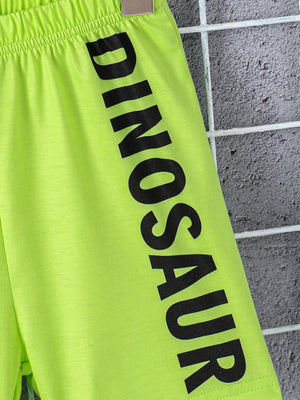 Neon green toddler shorts with black dinosaur text and elastic waistband.