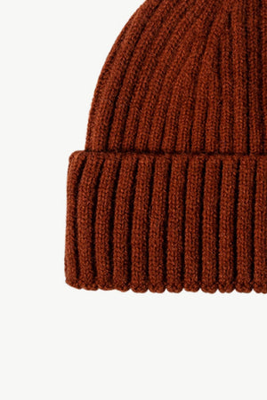 Chunky ribbed knit beanie in brown acrylic with a cuffed hem.