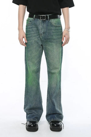 Ombre flare denim trousers in medium wash with green accents, cotton.