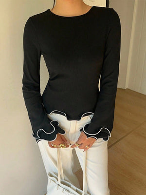 Black crew neck long sleeve t-shirt with ruffled cuffs and hem