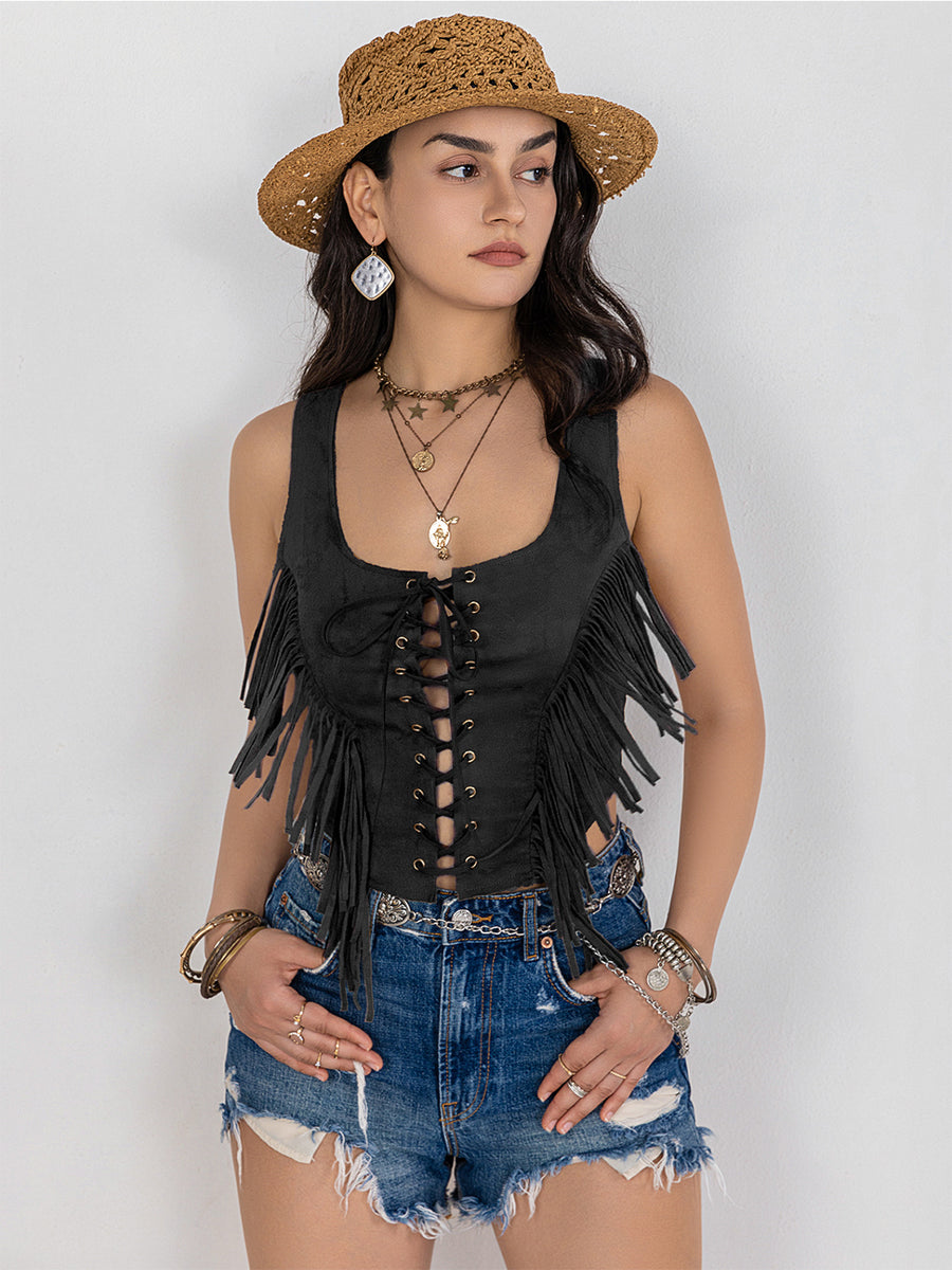 Black suede fringe corset vest with lace-up front detail and boho styling.
