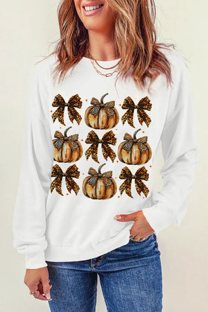 White crewneck sweatshirt with a pumpkin and leopard bow print.