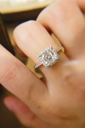 Silver ring with asscher cut moissanite center stone and diamond halo