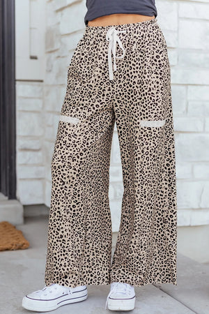 100% polyester Care instructions: Machine wash cold wide-leg pants in Leopard with flared silhouette