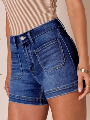 Dark blue denim shorts with high waist and utility pockets.