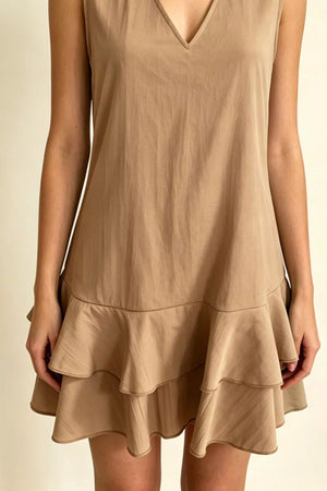 Taupe V-neck mini dress with tiered ruffle hem and sleeveless design.