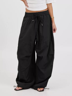 wide-leg pants in olive with drawstring waist and full-length