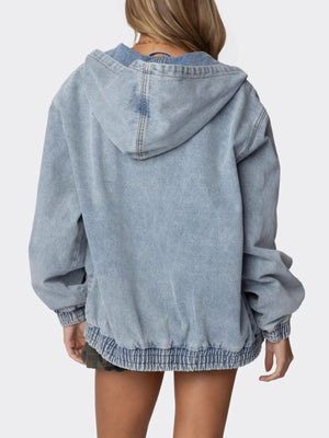 Light wash denim hooded oversized jacket with elastic cuffs and hem.