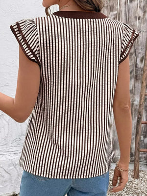 Vertical stripe blouse in black and white with brown trim and ruffle sleeves.