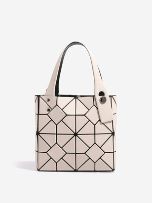 handbag in black with geometric and geometric panels
