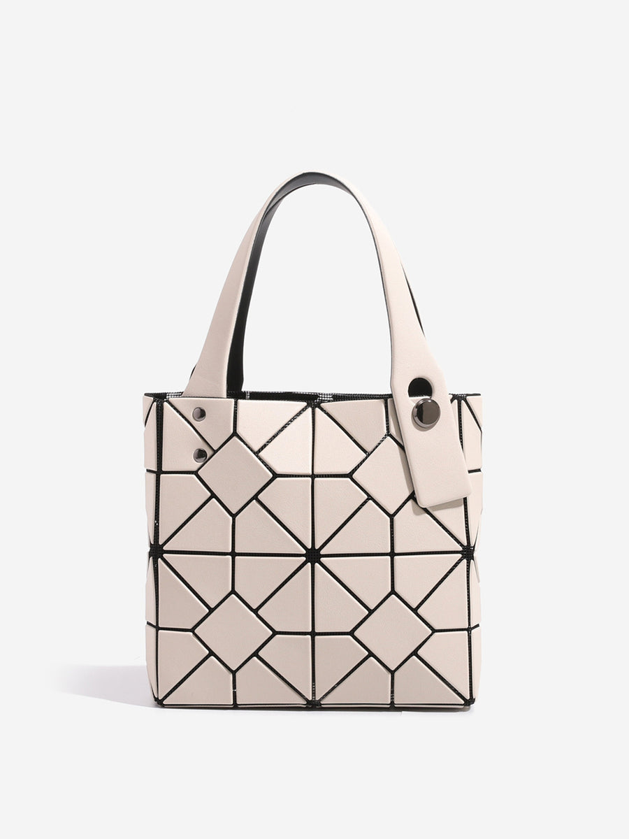 handbag in black with geometric and geometric panels
