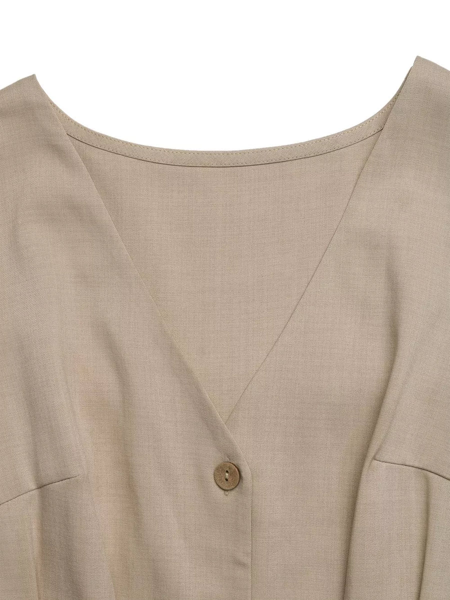 V-neck romper in beige with button detail and pocket detail