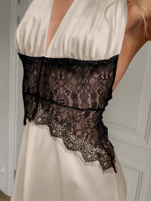 black maxi dress featuring lace detail and floral