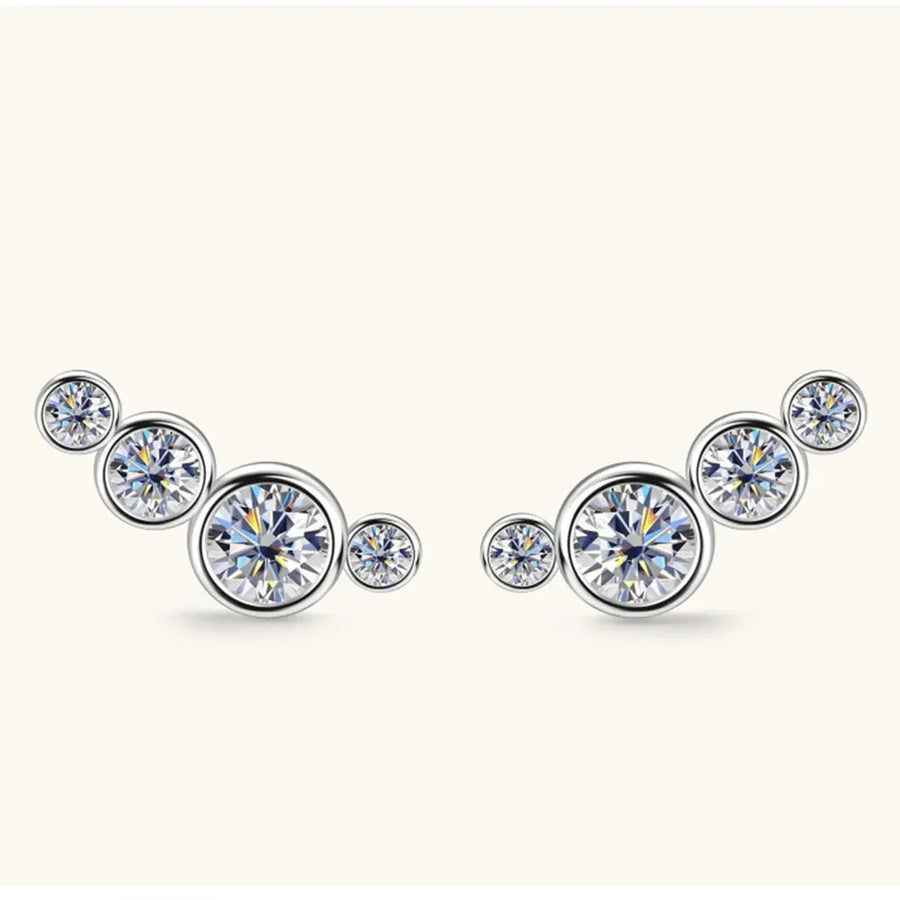 Silver ear climbers with five round, sparkling crystals in a graduated cluster design.