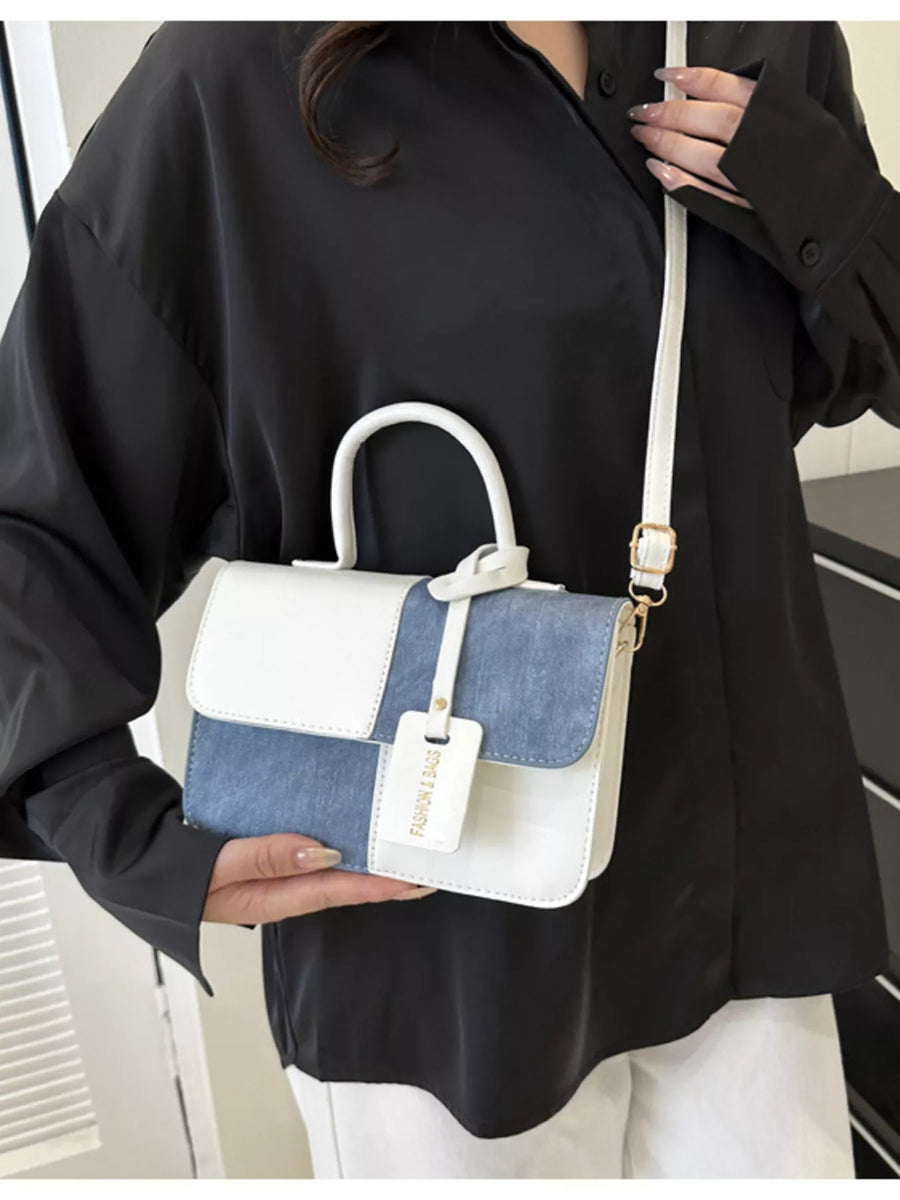 Chic two-tone PU leather crossbody bag with white and blue panels and a top handle.
