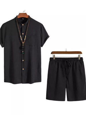 Black buttoned short-sleeve shirt with mandarin collar and drawstring shorts.
