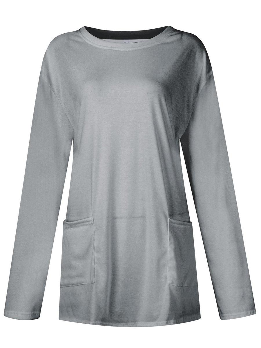 Gray relaxed fit tunic with long sleeves and two patch pockets.