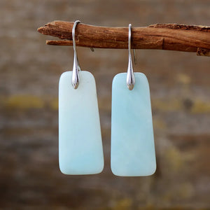 Aqua slab drop earrings with silver hooks and a light blue marbled stone.