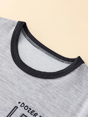 Toddler grey cotton blend tee with black trim neckline and construction graphic detail.